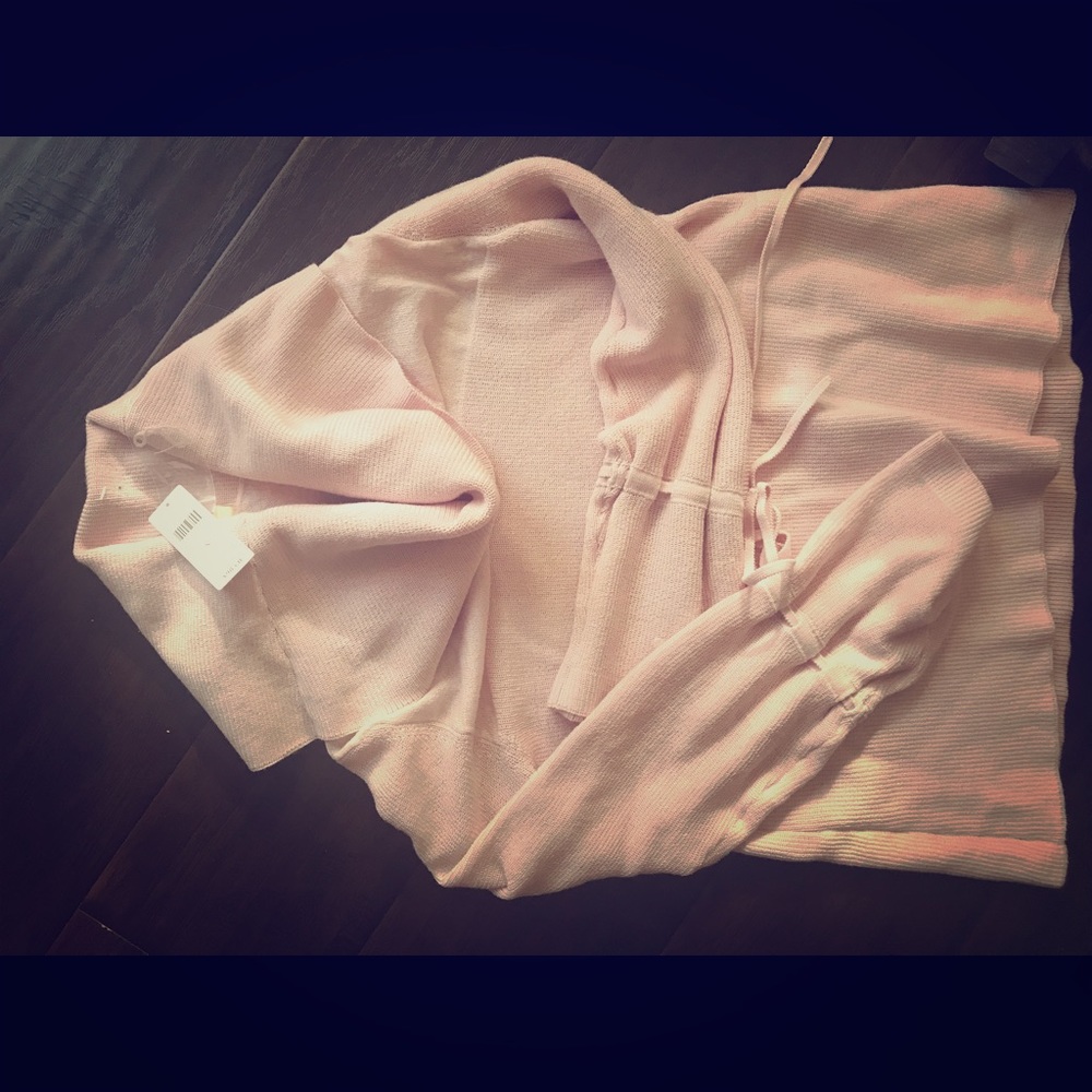 Cowl neck sweater in dusty pink.